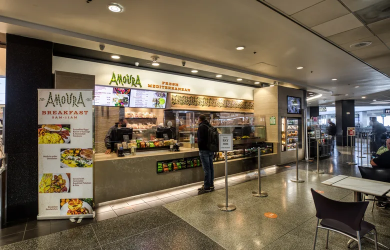 Customer at the counter of Amoura in Terminal 3